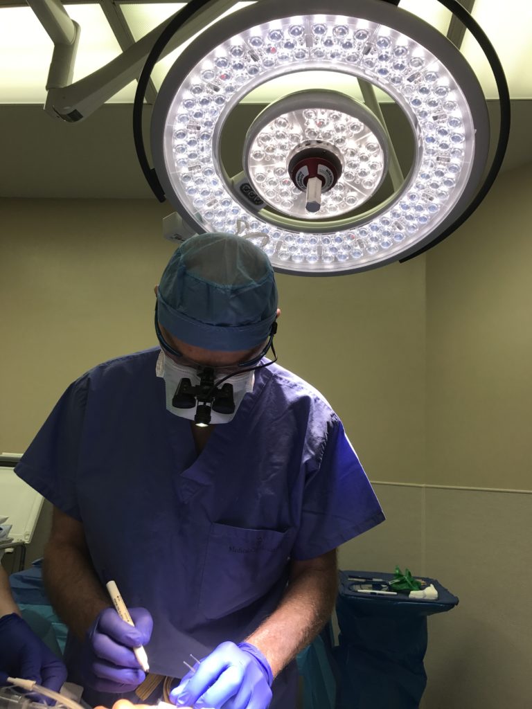 Photo of Dr. Kunkel marking the eyelids of a blepharoplasty patient in Fort Worth