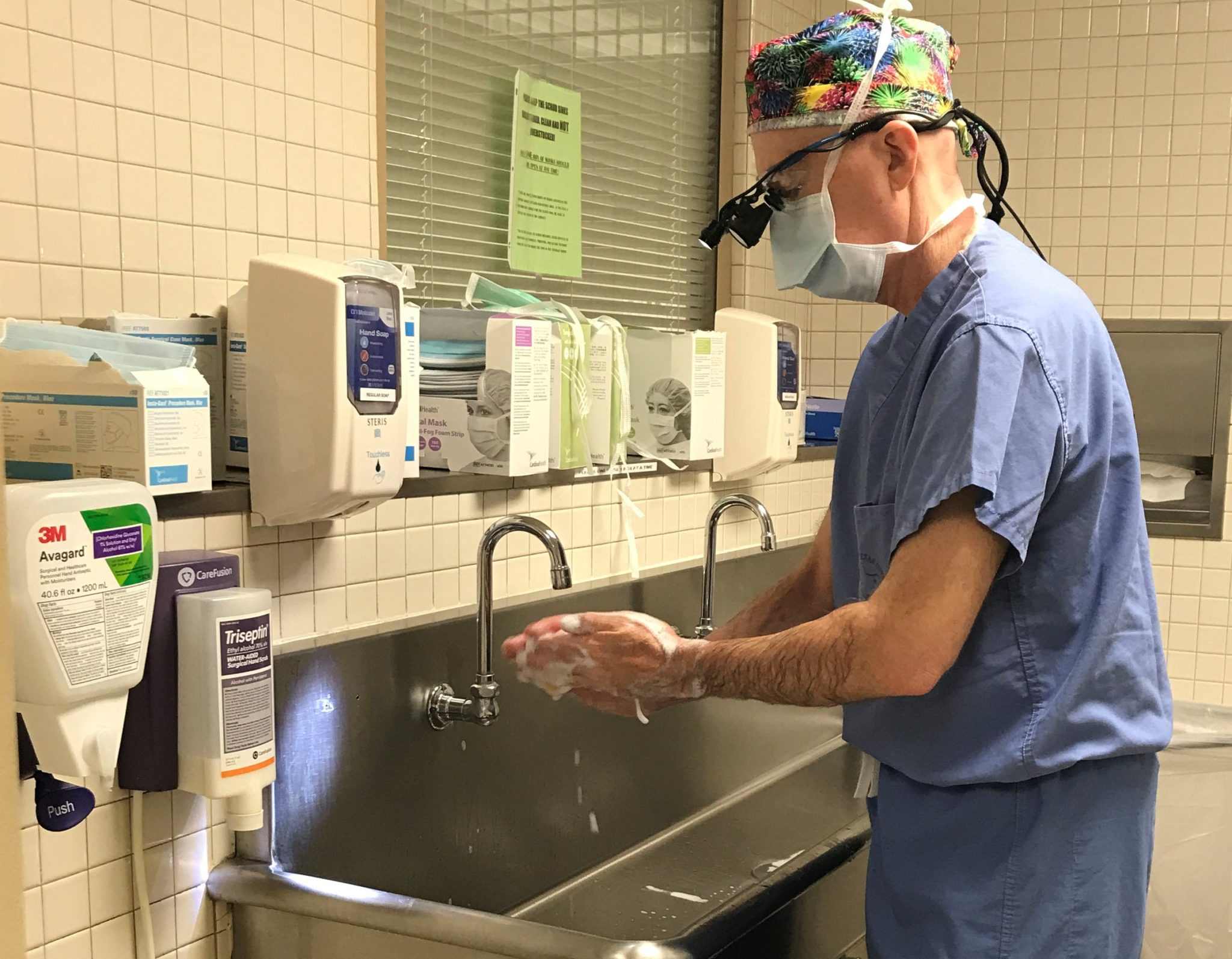 Fort Worth surgeon Dr. Kunkel washing hands before surgery