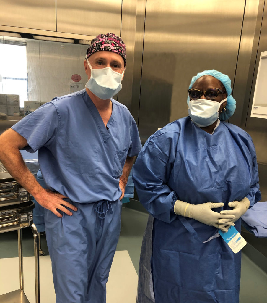 Fort Worth plastic surgeon Dr. Kunkel in the OR with a staff member