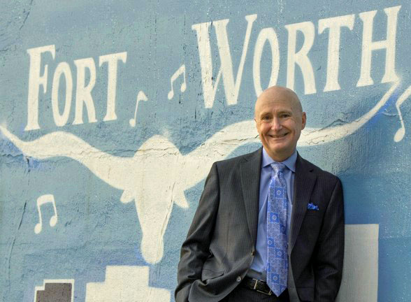Fort Worth plastic surgeon Dr. Kunkel by panther island mural