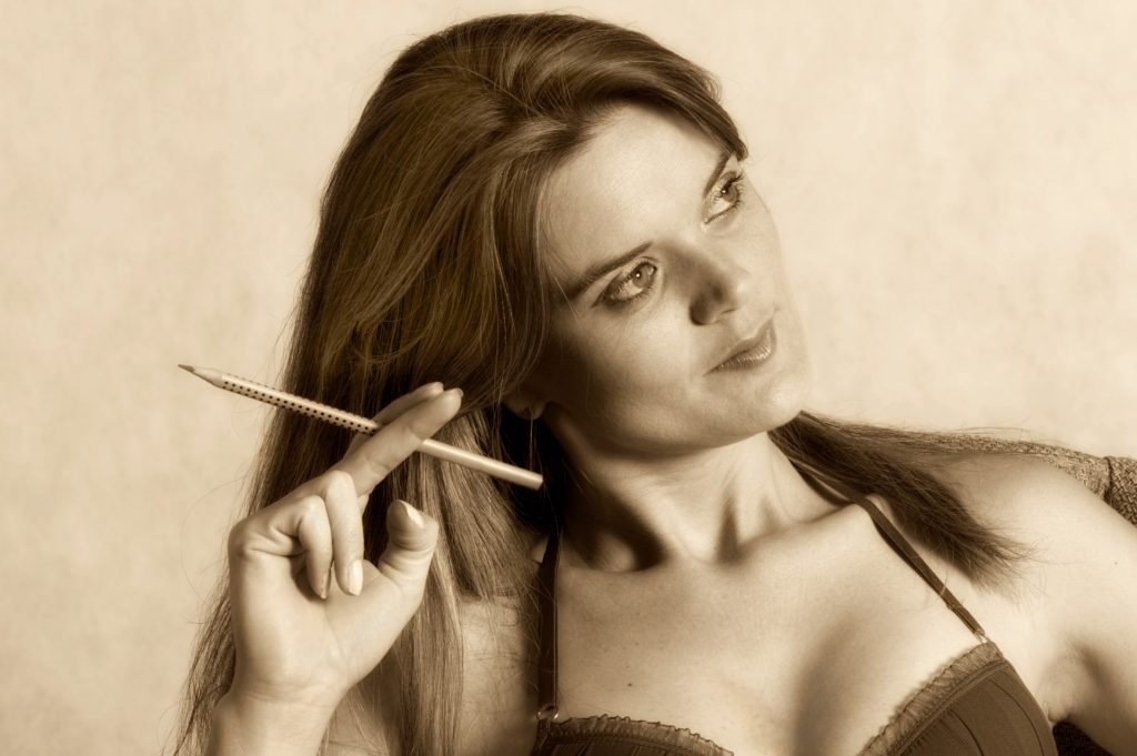 Photograph of a woman with a pencil