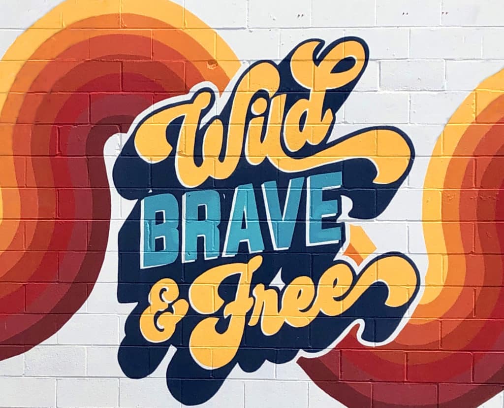 Wild Brave and Free colorful mural at Liberty Lounge in Fort Worth