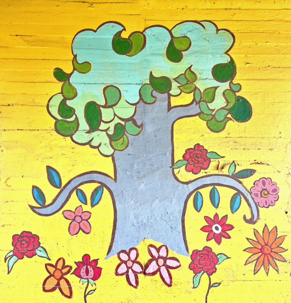 Tree and flowers, part of the Walls of Peace mural, at Lowden and Adams Street in Fort Worth Walls of Peace