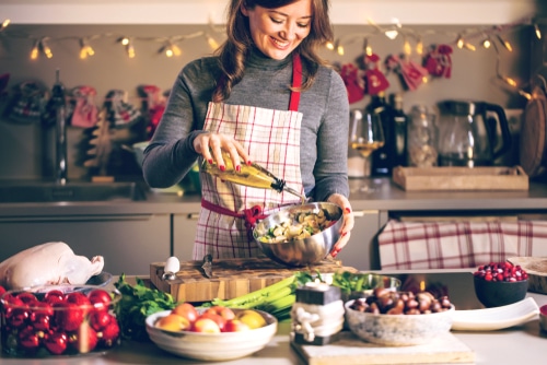 Young Woman Cooking in the kitchen.