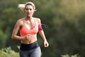 Jogging woman has easier time exercising after breast reduction surgery.