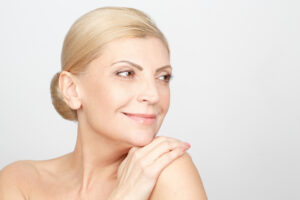 Woman in her 60s maintains youthful glow after eyelid surgery.